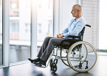 An old man on a wheelchair