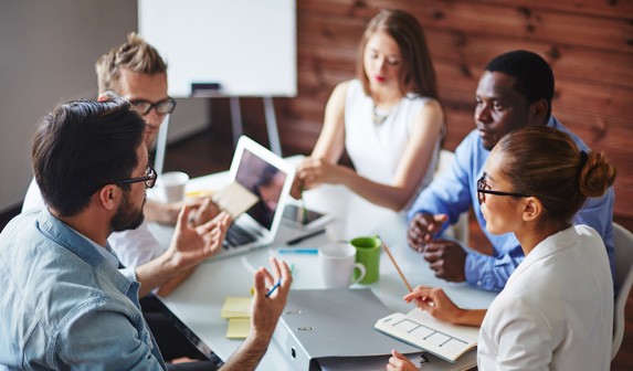 A coporate team having a meeting discussion