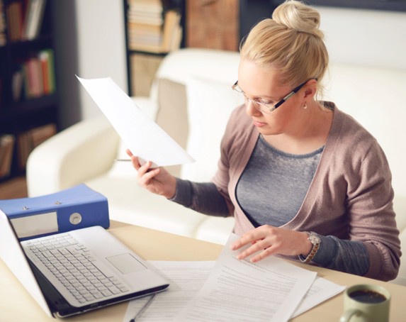 A woman looking at papers