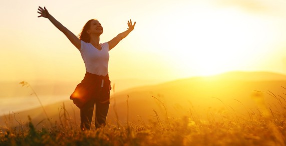 A woman raising her arms